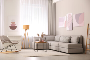 Canvas Print - Stylish living room interior with big comfortable sofa and pictures