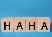 Wooden Cubes With The Text "Haha" Concept Of Laugh
