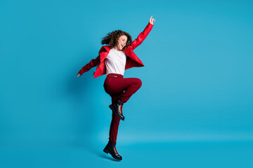 Poster - Full size profile photo of hooray girl jump wear red jacket trousers boots isolated on blue color background