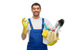 © Syda Productions - profession, service and people concept - happy smiling male worker or cleaner in overall and gloves with cleaning supplies showing ok hand sign over white background