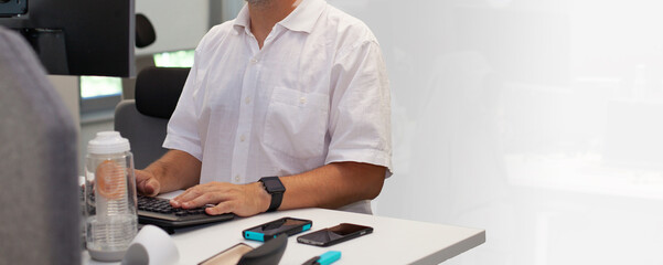 Poster - Closeup shot of a busy office man working in front of a computer