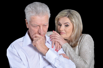 Portrait of sad senior couple posing