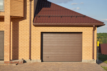 Wall Mural - Garage with automatic garage door attached to the house.