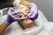 © fotofrol - Closeup of beautiful mouth and lips with botox and syringe
