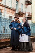 A man in a nineteenth century suit and a woman in a historical dress.