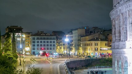 Poster - Square near Colosseum illuminated at night timelapse in Rome, Italy. Top view. Traffic on the road