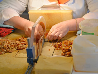 Wall Mural - Cutting amber stones with a circular table saw. Amber Processing Workshop