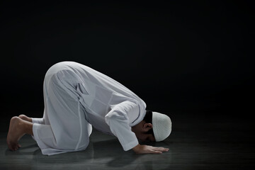 Wall Mural - Religious asian muslim man praying