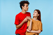 © SHOTPRIME STUDIO - man and woman standing side by side communication fashion modern style blue background