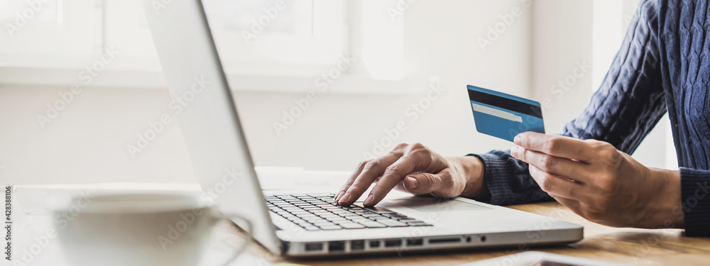 Woman using laptop computer with credit card making online order, banner. Business, online shopping, e-commerce, internet banking, spending money, working from home concept - obrazy, fototapety, plakaty 