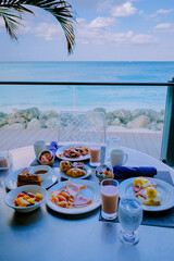 Wall Mural - breakfast with a sea view at the beach. Aruba