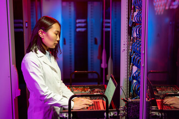Poster - Asian IT specialist performing diagnostic tests