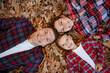 © zamuruev - photo of a wonderful family in the autumn forest on a leaves. To