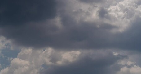 Wall Mural - dramatic sky with stormy gray clouds, hurricane rainy weather nature background. dark gray sky at se