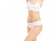 © Acronym - Close-up of a beautiful and fit female figure. Studio photo of young woman's body in swimsuit.