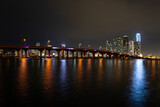 Fototapeta Nowy Jork - Beautiful Miami Florida skyline with lights and bay at sunset.