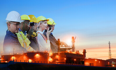 team and oil refinery, Teams engineer and foreman working at petrochemical oil refinery in sunset