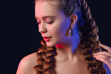 Canvas Print - Beautiful young woman with braided hair on dark background