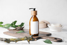 Bottle With Natural Shampoo On Light Background