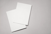Blank Sheets Of Paper On Grey Background