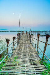 Wall Mural - Small Wooden Bridge with Soft Water in Kwan Phayao Lake