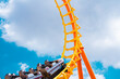 canvas print picture - roller coaster high in the summer sky at theme park most excited fun and joyful playing machine