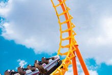 Roller Coaster High In The Summer Sky At Theme Park Most Excited Fun And Joyful Playing Machine