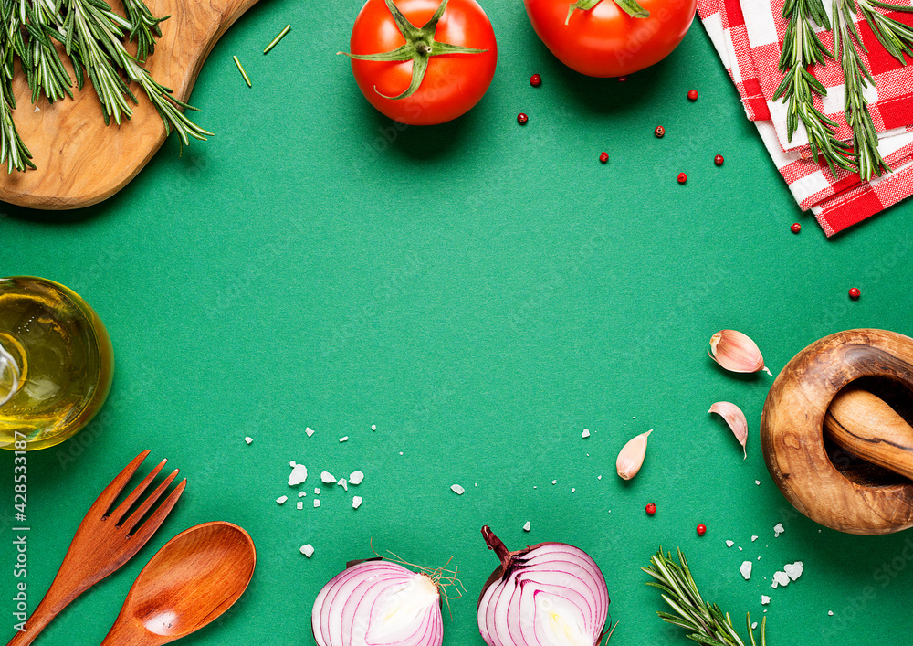 Cooking table. Green background with spices and vegetables. Top view ...