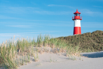 Wall Mural - lighthouse at the dune beach, sylt, schleswig-holstein, germany