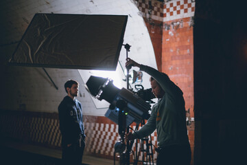 Wall Mural - Director of photography with a camera in his hands on the set.