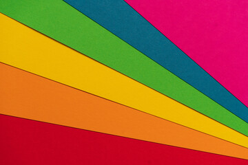 Wall Mural - Abstract Rainbow Colorful Paper Background.Rainbow fan. Colored sheets. Rainbow pride flag of LGBT organization.