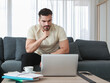 © Bangkok Click Studio - Thoughtful, serious Caucasian businessman working on laptop at home. Solving work problems and finding business inspiration concept.