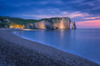 The chalk cliffs of Etretat after the sunset. Etretat, Normandy, France