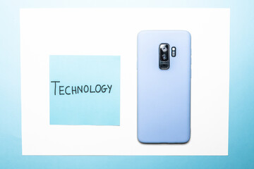 Sticker - Rearview of a smartphone with technology text on a blue and white surface