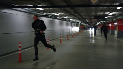 Canvas Print - Police chasing terrorist in urban building. Police officers trying to catch man