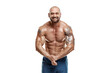 Tattooed male bodybuilder posing over white background. Fitness workout concept, muscle groups, watch your body.