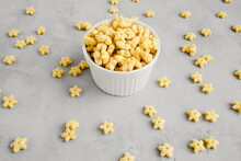 Breakfast Cereals сosmostars In Small White Plate And A Lot Of Stars Around. Food For Children 
