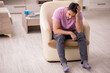 © Elnur - Young man siiting at home during pandemic