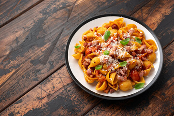 Wall Mural - Conchiglie alla Amatriciana pasta with pancetta bacon, tomatoes and pecorino cheese. Healthy Italian food