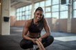 © Flamingo Images - Fit woman smiling after a rope workout