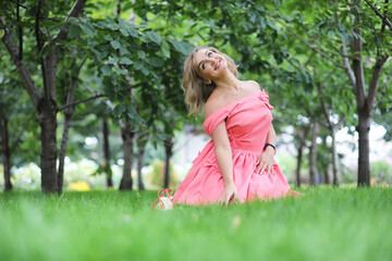 Wall Mural - Beautiful girl in the summer park