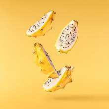 Creative Image With Fresh Yellow Pitaya Falling In The Air, Zero Gravity Food Conception