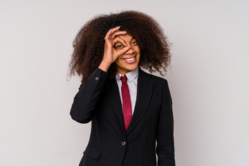 Young African American business woman wearing a suit isolated on white background excited keeping ok gesture on eye.