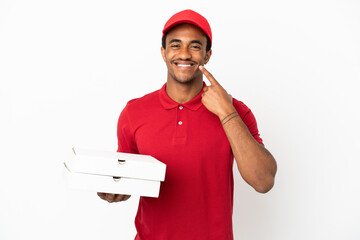 Wall Mural - African American pizza delivery man picking up pizza boxes over isolated white wall giving a thumbs up gesture