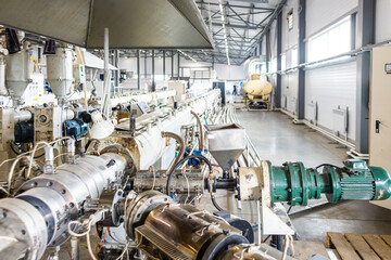 Inside factory. the interior of the equipment used in the polypropylene pipe production line