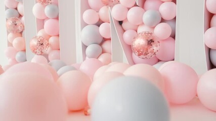 birthday decoration with white, pink and glitter balloons