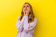 Young blonde caucasian woman isolated on yellow background whining and crying disconsolately.