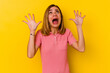 © Asier - Young caucasian skinny woman isolated on yellow background screaming to the sky, looking up, frustrated.