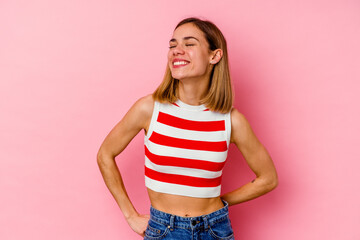 Sticker - Young caucasian woman isolated on pink background relaxed and happy laughing, neck stretched showing teeth.