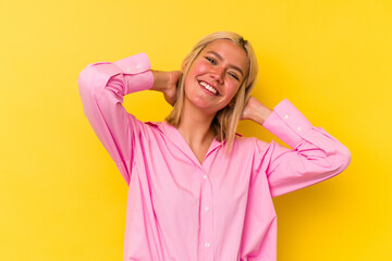 Young venezuelan woman isolated on yellow background stretching arms, relaxed position.